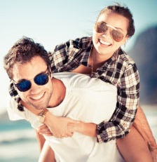 image of man and womand wearing sunglasses.